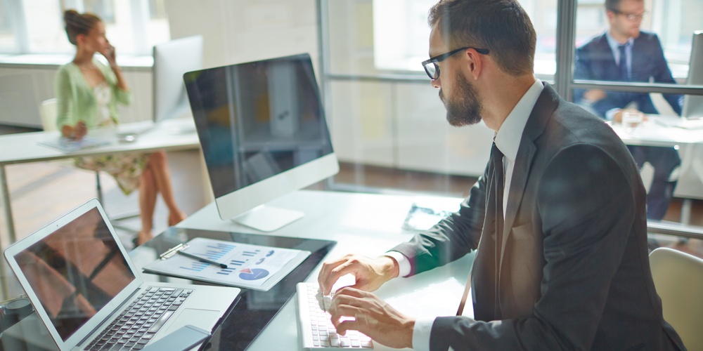 sales professional sitting at the computer