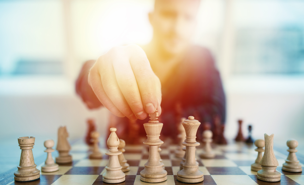 male playing chess