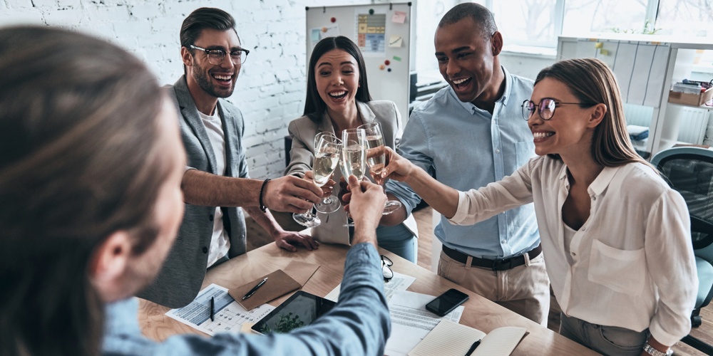 sales professional toasting champagne glasses